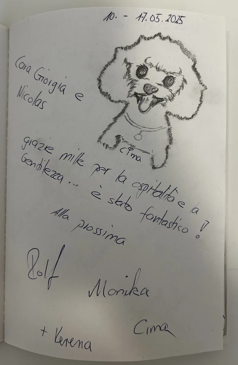 Guestbook page with a pencil drawing of a small poodle named Cima above a handwritten Italian thank-you note.